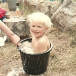 Camper Matt, aged 2, having a bath
