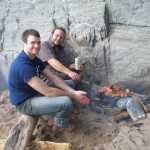 The two sons, now adults, enjoying a driftwood BBQ on Marloes Sands